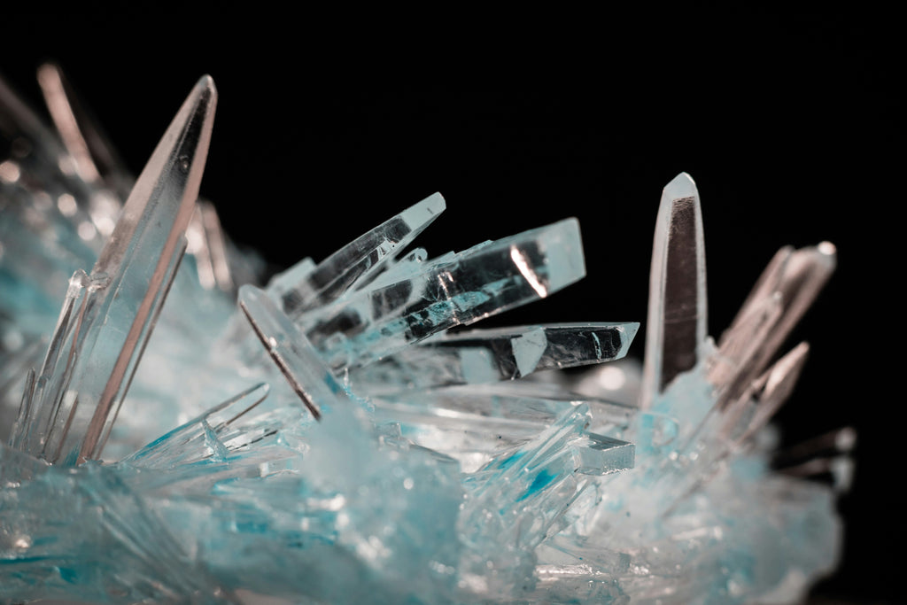 a tall, clear mountain crystal rising with inner strength and purity, representing clarity and grounded leadership presence