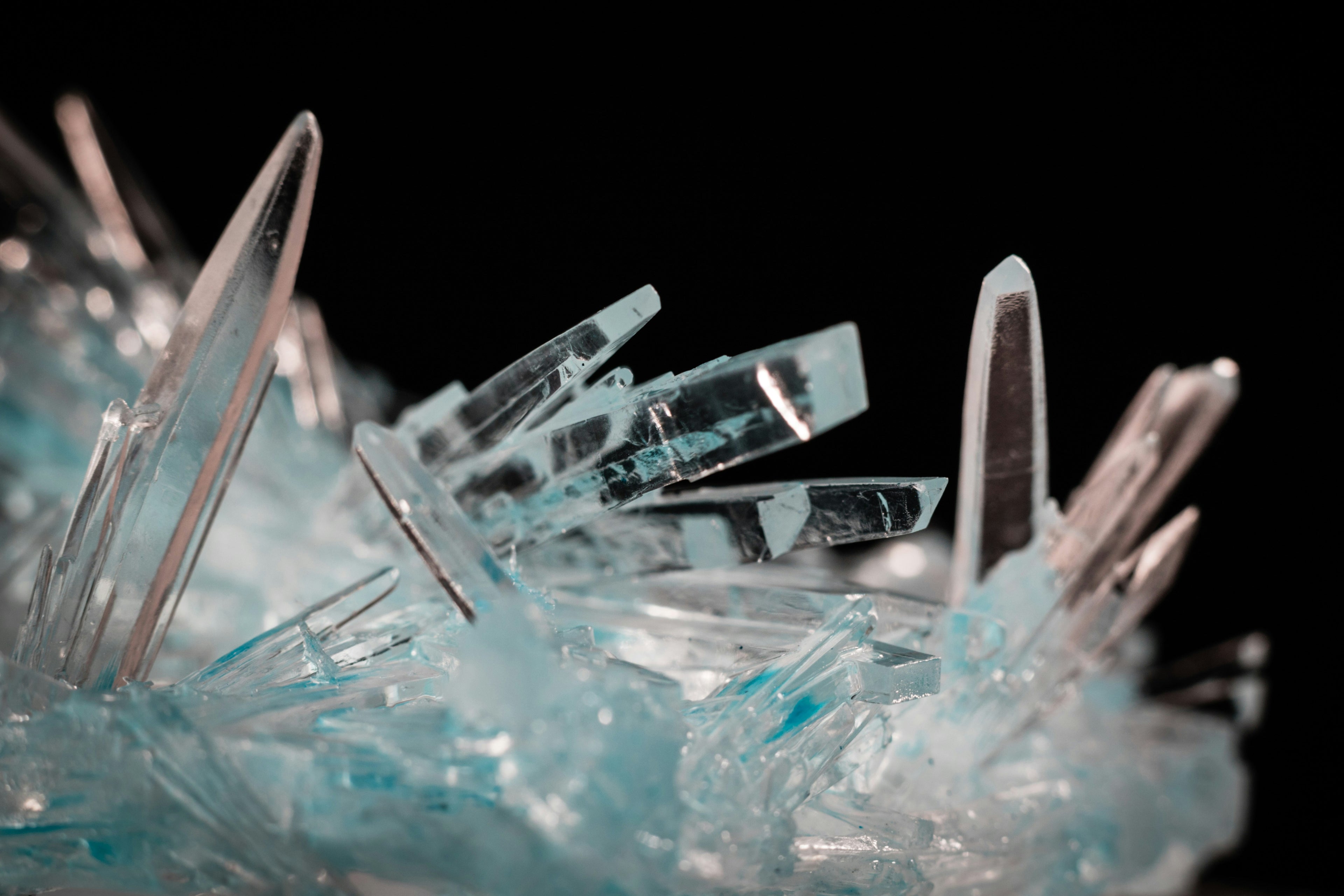 a tall, clear mountain crystal rising with inner strength and purity, representing clarity and grounded leadership presence