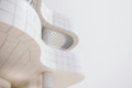 a modern architectural space with curved white surfaces resting on a solid foundation.
the image carries a sense of clarity and calm strength.