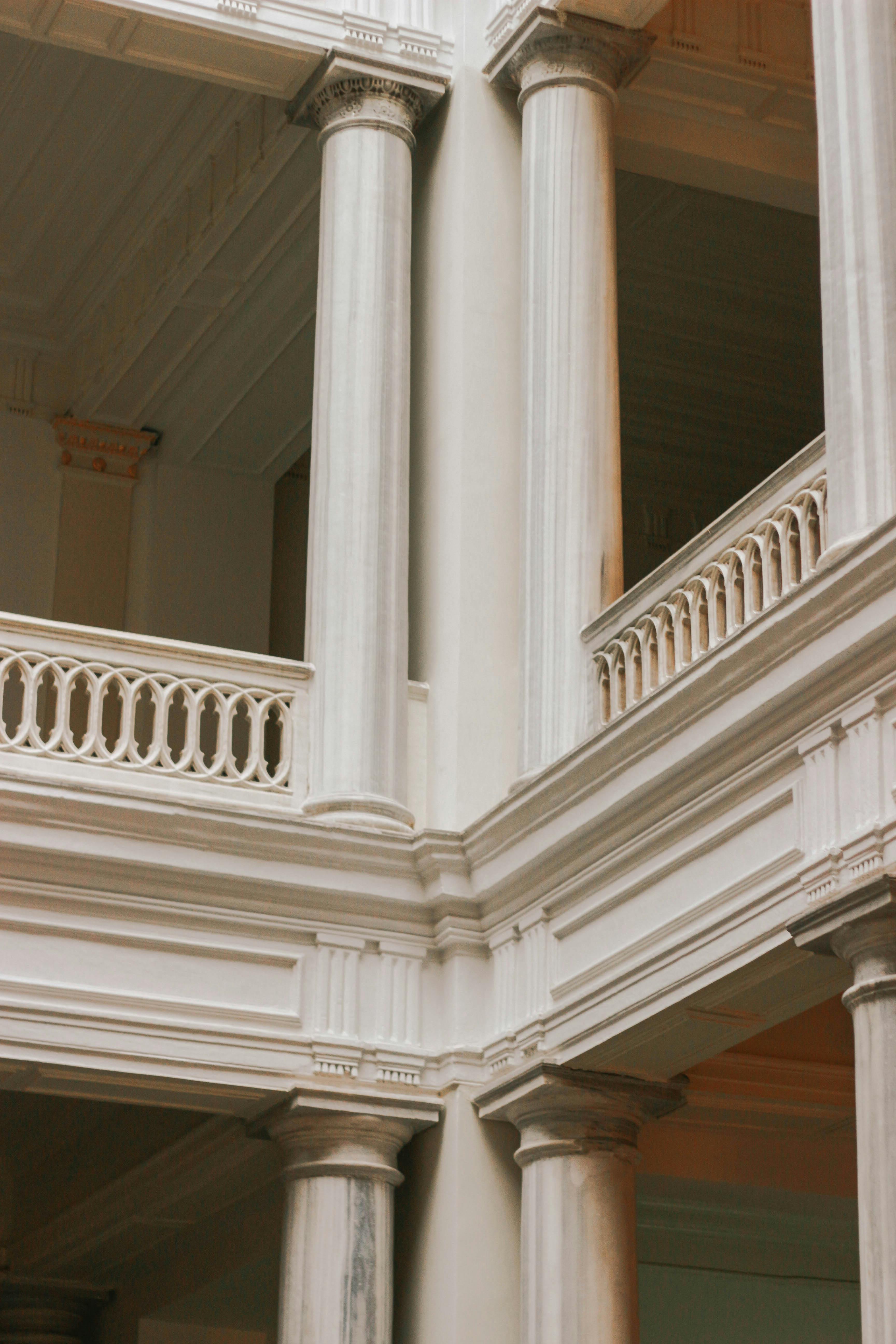 Interior of a classical building with columns and a balcony